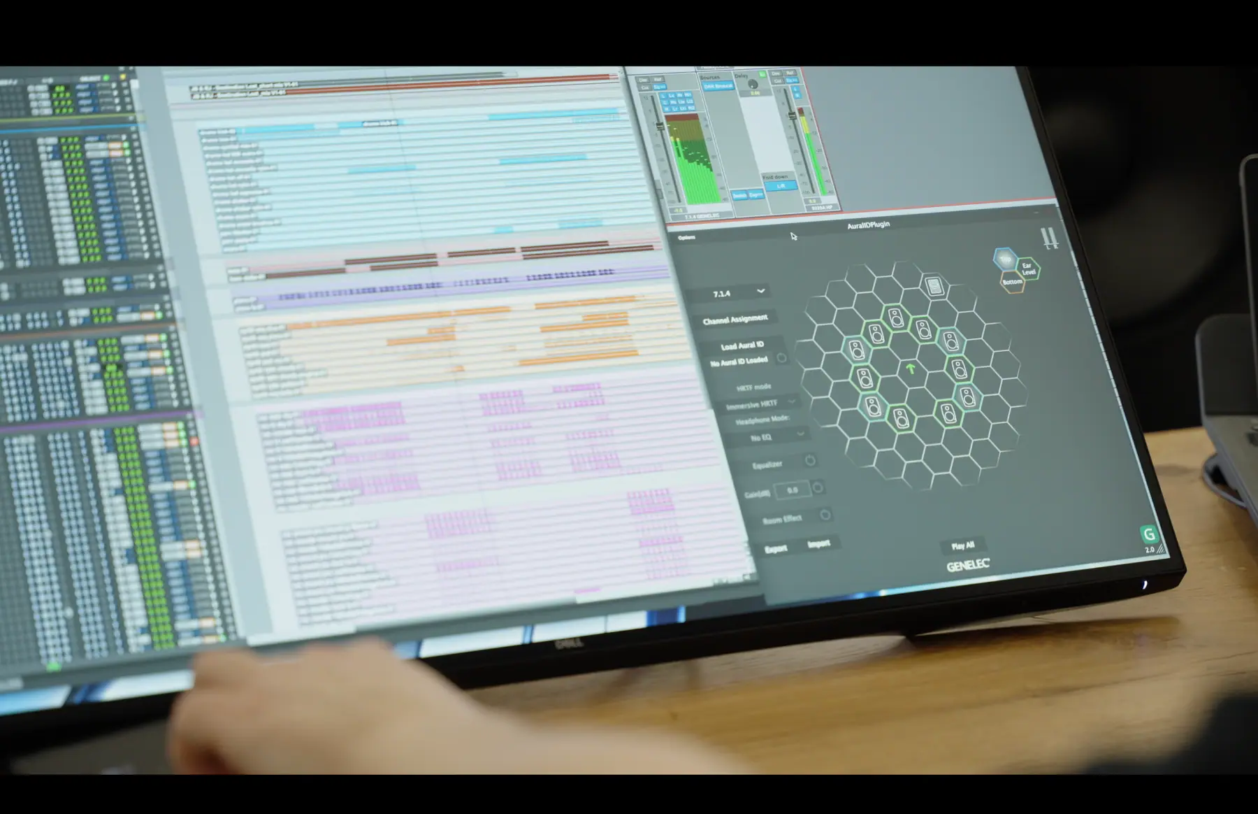 Screen of a running session: a DAW timeline next to the Genelec GLM 7.1.4 speaker layout view.